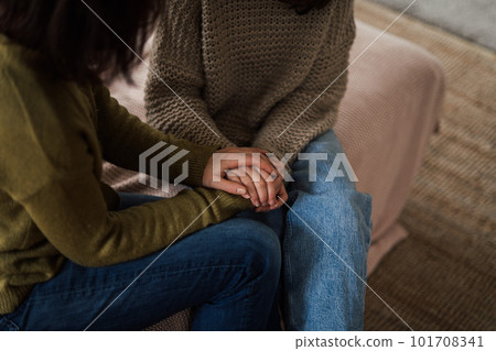 High angle view of mother consoling her daughter. 101708341