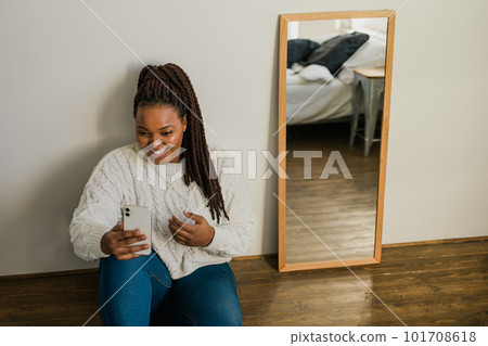 African american woman making video call in bedroom - social networks and connection African american woman making video call in bedroom - social networks and connection 101708618
