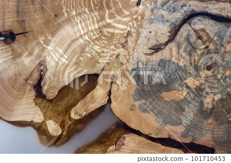 Tree cut slice section, uneven shape, natural texture, soft colored brown and yellow stump natural vintage cracked old colorful background. Do It Yourself art concept. Tree cut slice section, uneven shape, natural texture, soft colored brown and yellow stump natural vintage cracked old colorful background. Do It Yourself art concept. 101710453