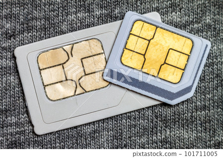 Set of mini and micro simcard. Isolated on grey cloth texture background 101711005