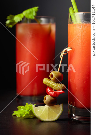 Cocktail Bloody Mary on a black background. Cocktail Bloody Mary on a black background. 101711144