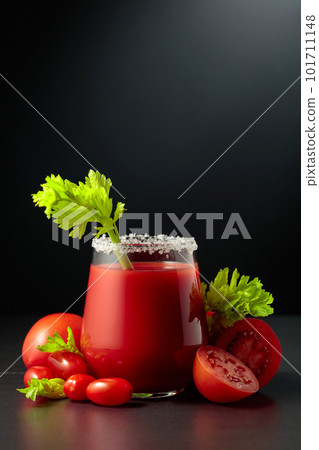 Fresh tomato juice or cocktail Bloody Mary with celery. 101711148