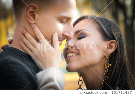Close-up portrait of young couple in love autumn outdoor outdoor 101711487