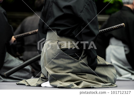 A person holding a Japanese sword A person holding a Japanese sword 101712327