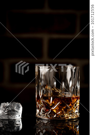 Whiskey with ice in glasses Whiskey with ice in glasses 101712556
