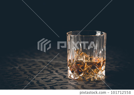 Whiskey with ice in glasses Whiskey with ice in glasses 101712558