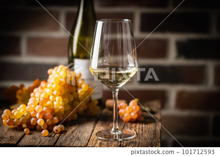 White wine in a glass White wine in a glass 101712593