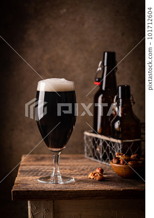 Glass of dark beer Glass of dark beer 101712604