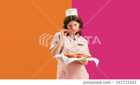 Portrait of young female waitress, sensual woman in retro american fashion style of 70s, 80s in action motion over vivid colors background. Food pop art 101713161