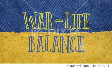 war-life balance words against paper abstract in blue and yellow colors of Ukrainian flag 101713201