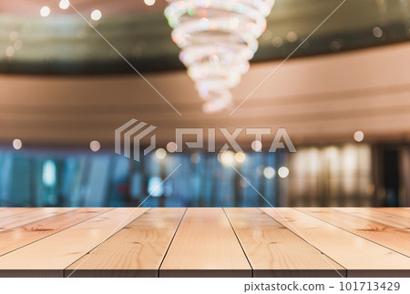 Empty wooden table top with lights bokeh on blur restaurant background. Empty wooden table top with lights bokeh on blur restaurant background. 101713429