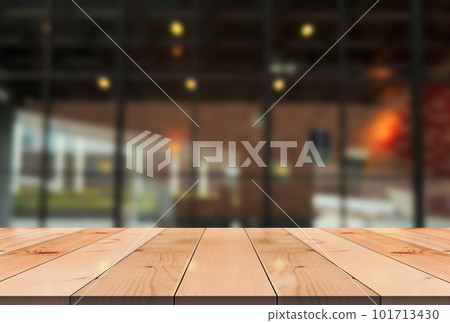 Empty wooden table top with lights bokeh on blur restaurant background. Empty wooden table top with lights bokeh on blur restaurant background. 101713430