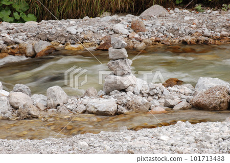 Stones stacked in a river in Berchtesgaden, Bavaria, Germany 101713488