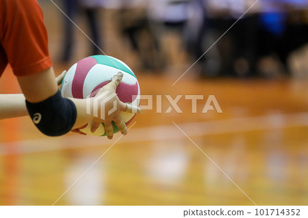 Hands at the moment of raising the toss for serve during a volleyball match 101714352