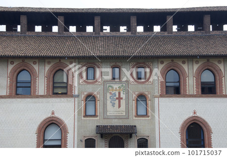 The building seen from the Sforzesco Castle courtyard. In the center is the coat of arms of the Visconti family and the coat of arms of the city of Milan. 101715037