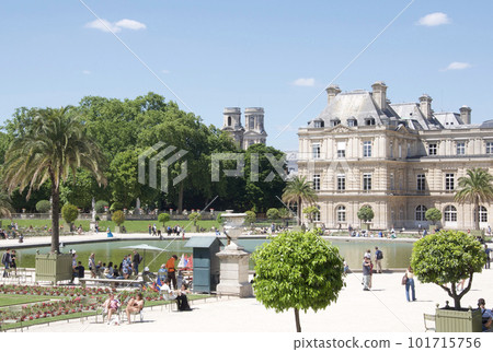 People having fun in the summer Luxembourg Gardens in the 6th district of Paris, France. Luxembourg Palace building People having fun in the summer Luxembourg Gardens in the 6th district of Paris, France. Luxembourg Palace building 101715756