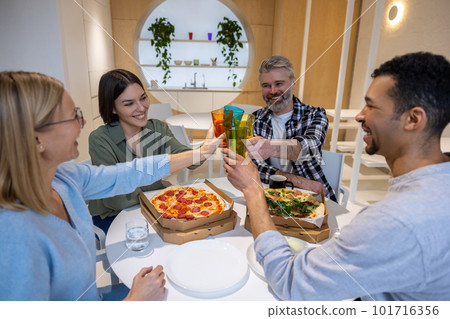 Group of people lookign haveing while having lunch together Group of people lookign haveing while having lunch together 101716356