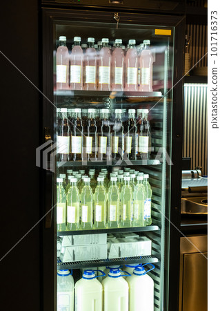 Coffee shop interior with a variety of bottled non-alcoholic beverages Coffee shop interior with a variety of bottled non-alcoholic beverages 101716373
