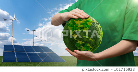 Woman holding a green planet Earth Woman holding a green planet Earth 101716928
