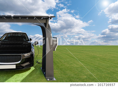 Electric car is charged from a charging station that takes energy from solar panels. Electric car is charged from a charging station that takes energy from solar panels. 101716937
