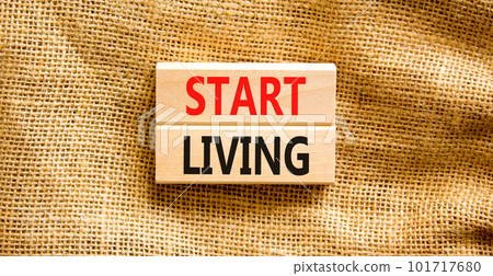 Start living symbol. Concept words Start living on beautiful wooden block. Beautiful canvas table canvas background. Business and Start living concept. Copy space. Start living symbol. Concept words Start living on beautiful wooden block. Beautiful canvas table canvas background. Business and Start living concept. Copy space. 101717680