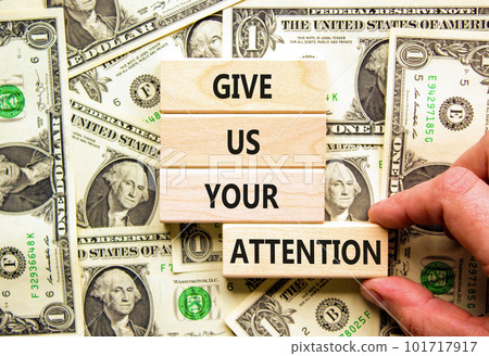 Give us your attention symbol. Concept words Give us your attention on wooden block. Beautiful background from dollar bills. Motivational business give us your attention concept. Copy space. Give us your attention symbol. Concept words Give us your attention on wooden block. Beautiful background from dollar bills. Motivational business give us your attention concept. Copy space. 101717917