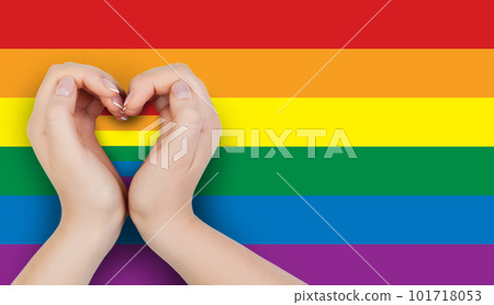 Female hand holding heart with LGBT flag 101718053