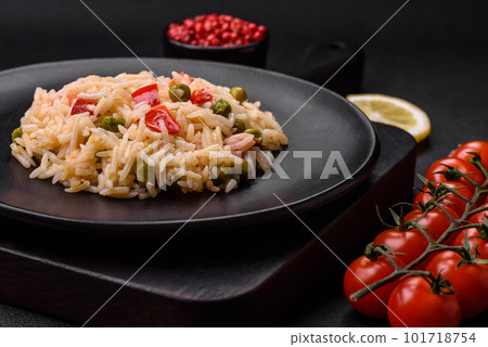 Delicious boiled rice with vegetables peppers, carrots, peas and asparagus beans 101718754