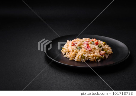 Delicious boiled rice with vegetables peppers, carrots, peas and asparagus beans Delicious boiled rice with vegetables peppers, carrots, peas and asparagus beans 101718758