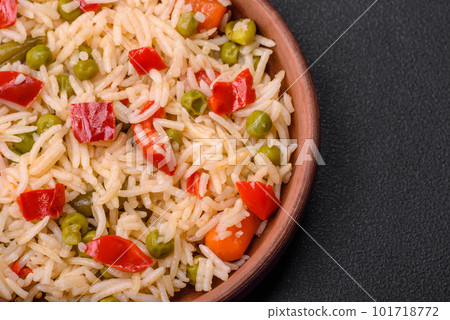 Delicious boiled rice with vegetables peppers, carrots, peas and asparagus beans 101718772