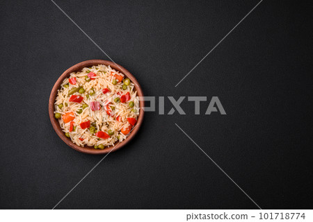 Delicious boiled rice with vegetables peppers, carrots, peas and asparagus beans 101718774