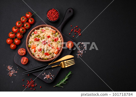 Delicious boiled rice with vegetables peppers, carrots, peas and asparagus beans 101718784