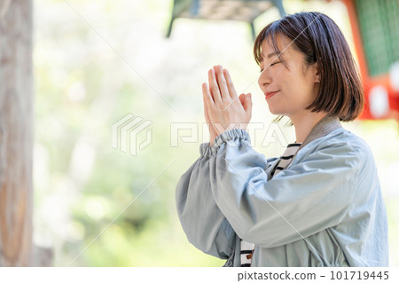 A woman traveling A woman taking pictures at a tourist spot A woman enjoying sightseeing A woman strolling at a tourist spot A woman traveling on a holiday 101719445