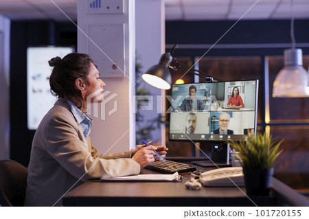 Busiensswoman having remote discussion with business team, discussing marketing statistics. Colleagues planning financial strategy to increase profit, working overtime in startup office Busiensswoman having remote discussion with business team, discussing marketing statistics. Colleagues planning financial strategy to increase profit, working overtime in startup office 101720155