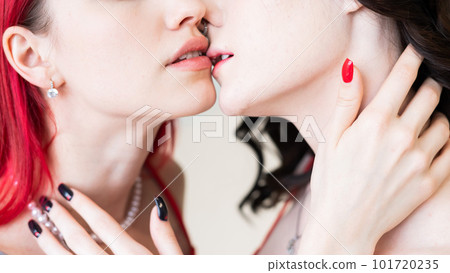 Close-up portrait of kissing Caucasian women. same sex love. Close-up portrait of kissing Caucasian women. same sex love. 101720235