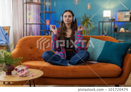 Woman breathes deeply with mudra gesture eyes closed, meditating with concentrated thoughts peaceful Woman breathes deeply with mudra gesture eyes closed, meditating with concentrated thoughts peaceful 101720474