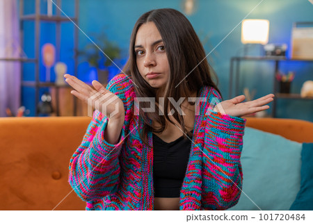 Confused young woman girl feeling embarrassed about ambiguous question, having doubts, no idea Confused young woman girl feeling embarrassed about ambiguous question, having doubts, no idea 101720484