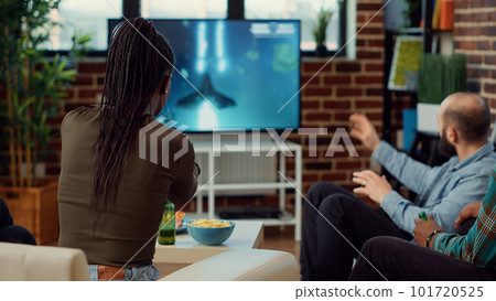 Multiethnic group of people playing online video games on tv