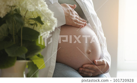 Pregnant woman's belly. Pregnant woman touching caressing her belly. Healthy Pregnancy Maternity Motherhood concept. Mother hands on pregnant tummy. waiting for baby, Happy family, expecting baby 101720928