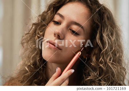 Facial skincare using gadgets and serums for smoother, moisturized skin and reduced wrinkles. Facial skincare using gadgets and serums for smoother, moisturized skin and reduced wrinkles. 101721169