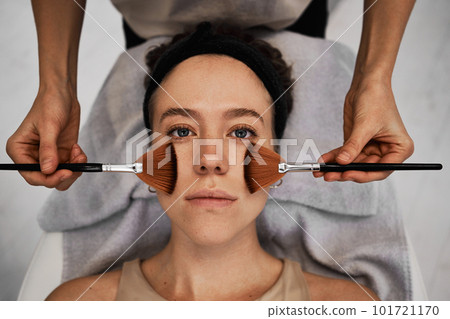 Facial skincare using gadgets and serums for smoother, moisturized skin and reduced wrinkles. 101721170
