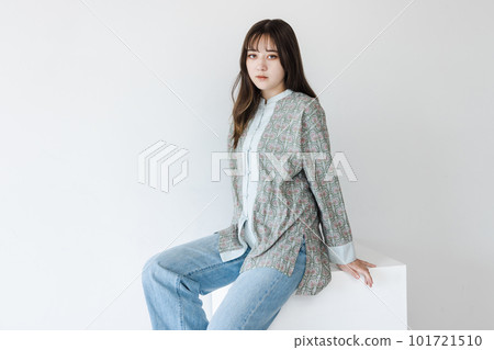 Half woman sitting on a white block Half woman sitting on a white block 101721510