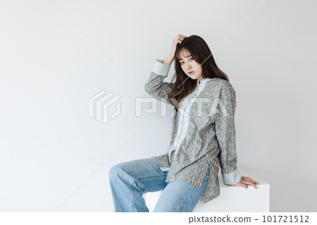 Half woman sitting on a white block Half woman sitting on a white block 101721512