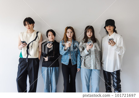 Generation Z men and women using smartphones Generation Z men and women using smartphones 101721697