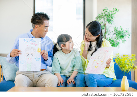 Respect for the Aged Day Grandparents receiving portraits from their grandchildren 101722595