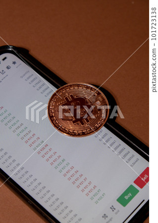 Bitcoin gold coin on background of Stock Market Chart. Bitcoin mining trading concept. BTC golden money. Worldwide virtual internet Cryptocurrency or crypto digital payment system Bitcoin gold coin on background of Stock Market Chart. Bitcoin mining trading concept. BTC golden money. Worldwide virtual internet Cryptocurrency or crypto digital payment system 101723138