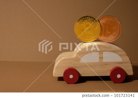 Bitcoin gold coin with wooden toy car. Saving and manage money for transport car loan mining trading concept. Automotive transportation industry merge with technology exchange financial market can pay Bitcoin gold coin with wooden toy car. Saving and manage money for transport car loan mining trading concept. Automotive transportation industry merge with technology exchange financial market can pay 101723141
