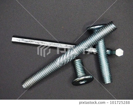 Photo of screws and hex wrench taken from above | Black background, close-up Photo of screws and hex wrench taken from above | Black background, close-up 101725288