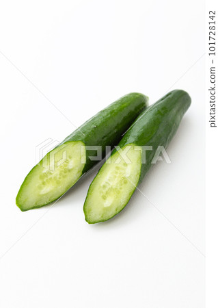 Cucumber cut in half white background Cucumber cut in half white background 101728142
