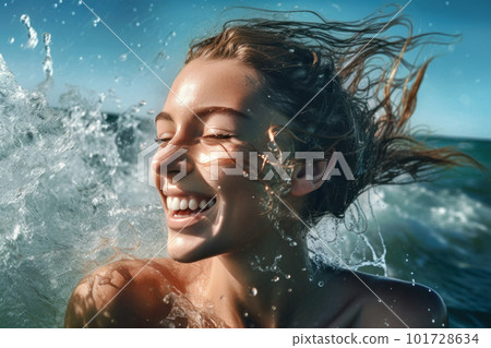A woman playing in the summer sea and water splashes 101728634
